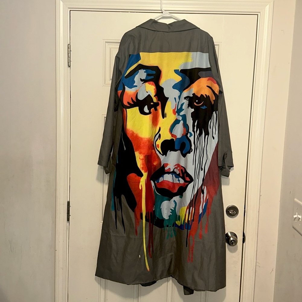 Beautiful colorful long jacket with pockets and buttons.